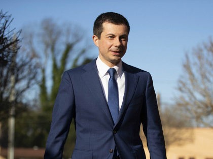 Democratic presidential candidate and former South Bend, Ind. Mayor Pete Buttigieg walks to speaks with members of the media, Sunday, March 1, 2020, in Plains, Ga. (AP Photo/Matt Rourke)