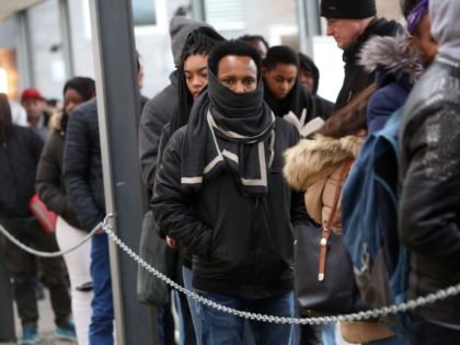 BERLIN, GERMANY - FEBRUARY 06: Foreigners wait outside the Berlin Immigration Office (Land