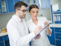 scientists with clipboards