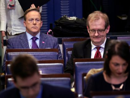 Former White House press secretary Sean Spicer and reporter for Newsmax, top left, listens during a coronavirus task force briefing at the White House, Friday, March 20, 2020, in Washington. (AP Photo/Evan Vucci)