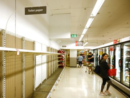 Shelves are empty of toilet rolls in a supermarket in Sydney on March 4, 2020. - Australia's biggest supermarket announced a limit on hand sanitisers and toilet paper purchases after the global spread of coronavirus sparked a spate of panic buying Down Under. (Photo by PETER PARKS / AFP) (Photo …