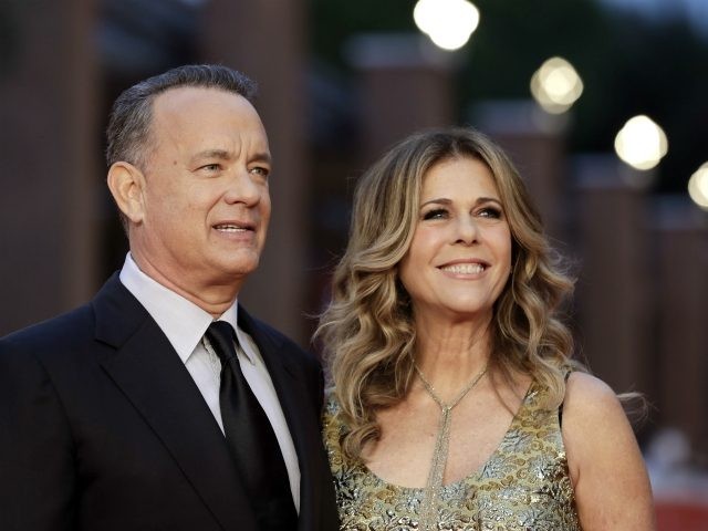 FILE - In this Thursday, Oct. 13, 2016, file photo, Actor Tom Hanks, left, flanked by his