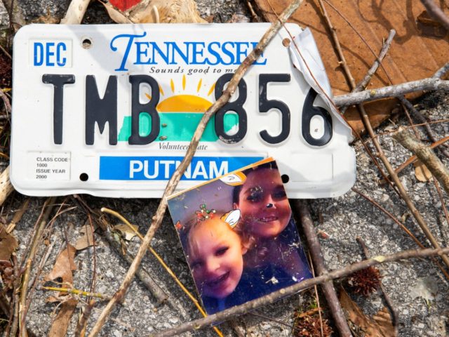 COOKEVILLE, TN - MARCH 03: Detail view of a family photograph and license plate in debris