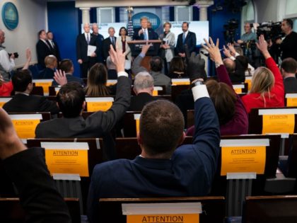 trump-white-house-coronavirus-press-conference-reporters-raising-hands-AP