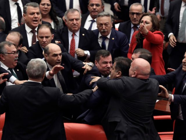 Legislators push each other as a brawl breaks out in Turkey's parliament in Ankara, Turkey