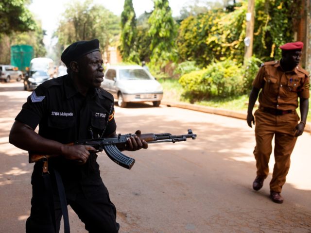 KAMPALA, UGANDA - FEBRUARY 20: Police fire live rounds both into the air and towards journ