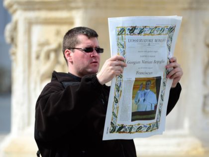 VATICAN CITY, VATICAN - MARCH 14: A man holds up a copy of the L'Osservatore Romano in St Peters square on March 14, 2013 in Vatican City, Vatican. A day after thousands gathered in St Peter's Square to watch the announcement of the first ever Latin American Pontiff it has …