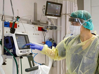 This picture taken on March 16, 2020 during a press presentation of the hospitalisation service for future patients with coronavirus at Samson Assuta Ashdod University Hospital in the southern Israeli city of Ashdod, shows the director of the epidemics service Dr Karina Glick checking a medical ventilator control panel at …
