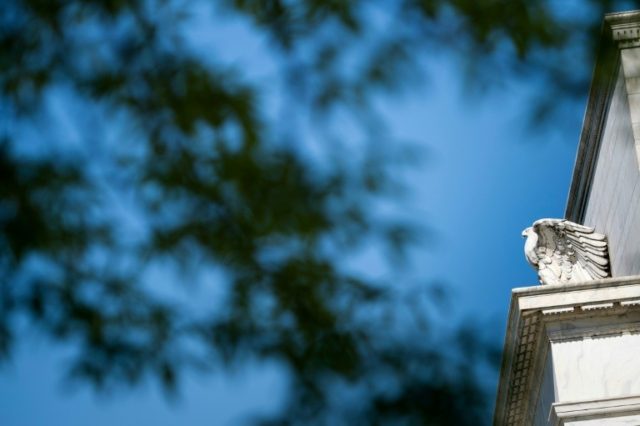 Stocks markets stronger, but off highs, after Fed rate cut