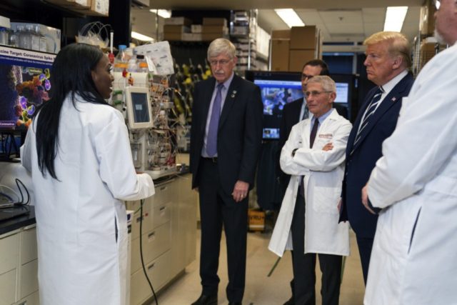 Virus Outbreak Vaccine Science Donald Trump In this Tuesday, March 3, 2020 file photo, Dr. Kizzmekia Corbett, left, senior research fellow and scientific lead for coronavirus vaccines and immunopathogenesis team in the Viral Pathogenesis Laboratory, talks with President Donald Trump as he tours the Viral Pathogenesis Laboratory at the National Institutes of Health in Bethesda, Md. Dozens of research groups around the world are racing to create a vaccine as COVID 19 cases continue to grow. (AP Photo/Evan Vucci) The Associated Press
