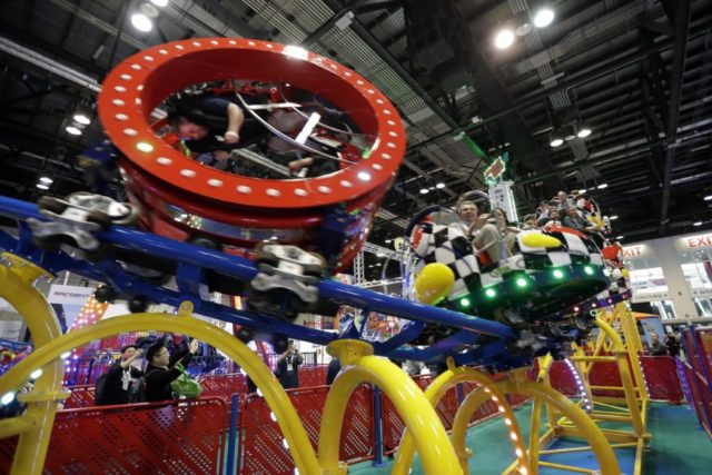 Virus Outbreak Florida Theme Parks In this Nov. 19, 2019, file photo, attendees try out a roller coaster where the cars spin and turn on display at the International Association of Amusement Parks and Attractions convention in Orlando, Fla. Orlando is the nation's most visited tourist destination, bringing vast numbers of people from around the globe to its major theme parks, which also include Universal Orlando and SeaWorld Orlando. The city attracted 75 million visitors in 2018. But it's also at least 65 miles (105 kilometers) from the nearest coronavirus case. Though some convention business has canceled because of concerns, individual leisure travel hasn't been affected, local officials said. (AP Photo/John Raoux, File) The Associated Press