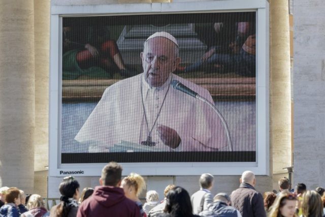 APTOPIX Vatican Virus Outbreak Faithful watch Pope Francis deliver the Angelus prayer on a giant screen, in St. Peter's Square, at the Vatican, Sunday, March 8, 2020. Italy's Prime Minister Giuseppe Conte announced a sweeping coronavirus quarantine early Sunday, restricting the movements of about a quarter of the country's population in a bid to limit contagions at the epicenter of Europe's outbreak. (AP Photo/Andrew Medichini) The Associated Press