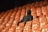A statue representing a former fan is pictured ahead of the Champions League round of 16 second leg soccer match between Valencia and Atalanta in Valencia, Spain, Tuesday March 10, 2020. The match is being in an empty stadium because of the coronavirus outbreak. (UEFA via AP)