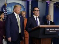 Treasury Secretary Steven Mnuchin speaks during a press briefing with the coronavirus task force, at the White House, Tuesday, March 17, 2020, in Washington, as President Donald Trump looks on. (AP Photo/Evan Vucci)
