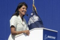 In this June 10, 2011 file photo former South Carolina Gov. Nikki Haley speaks during the dedication of Boeing Co.'s $750 million final assembly plant in North Charleston, S.C. Haley has resigned, Thursday, March 19, 2020, from the board of Boeing Co., cutting ties with a company she long supported &hellip;
