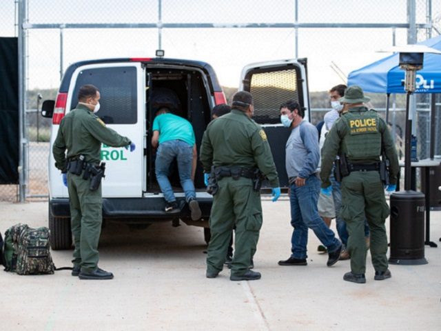Border Patrol agents apprehend a group of migrants who illegally crossed the border from Mexico. (CBP Photo by Jerry Glaser)
