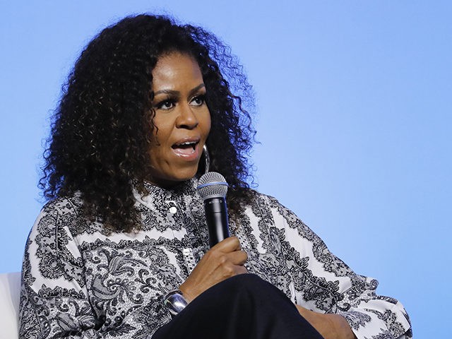 Former U.S. fist lady Michelle Obama speaks during an event for Obama Foundation in Kuala Lumpur, Malaysia, Thursday, Dec. 12, 2019. Obama and actress Julia Roberts attend inaugural Gathering of Rising Leaders in the Asia Pacific organized by the Obama Foundation. (AP Photo/Vincent Thian)
