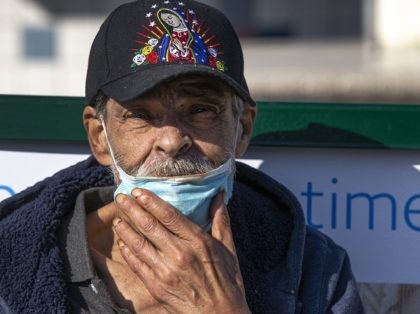 Jose Villanueva, 77, originally from Durango, Mexico, adjusts his face mask after eating in the Boyle Heights area of Los Angeles on Wednesday, April 1, 2020. Los Angeles Mayor Eric Garcetti has recommended that the city's 4 million people wear masks when going outside amid the spreading coronavirus. Garcetti on …