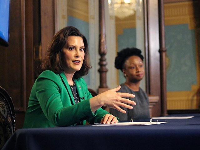 In a pool photo provided by the Michigan Office of the Governor, Michigan Gov. Gretchen Whitmer addresses the state during a speech in Lansing, Mich., Thursday, April 9, 2020. The governor signed an executive order extending her prior "Stay Home, Stay Safe" order through the end of April. The order …