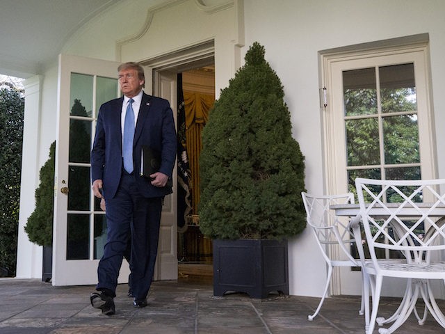 President Donald Trump steps out of the Oval Office to speak about the coronavirus in the Rose Garden of the White House, Wednesday, April 15, 2020, in Washington. (AP Photo/Alex Brandon)