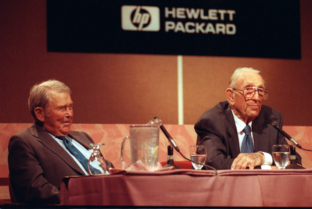 David Packard, right, co-founder of the Silicon Valley computer company Hewlett-Packard, announces his retirement as chairman during a news conference at HP's headquarters in Palo Alto, Calif., on Sept. 17, 1993. Packard, 81, started the company in 1939 with William R. Hewlett, who listens at left. (AP Photo/Joe Pugliese)