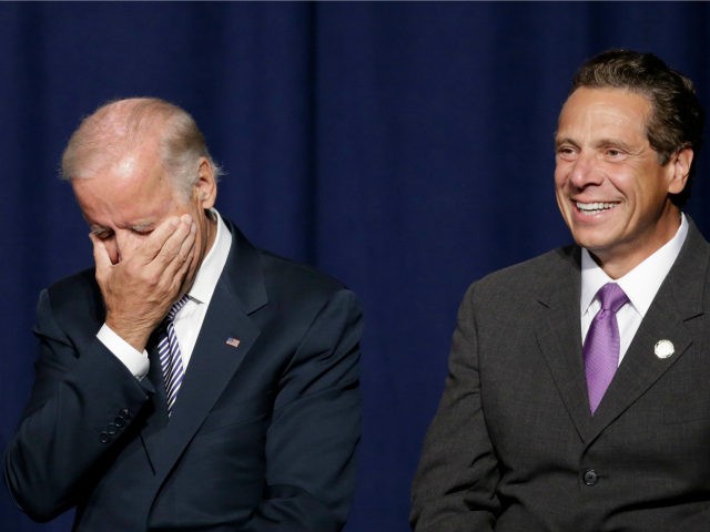Vice President Joe Biden covers his face with his hand and New York Gov. Andrew Cuomo laug