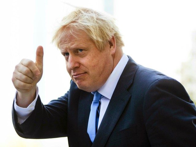 Britain's Prime Minister Boris Johnson gestures as he departs from Hudson Yards, in New Yo