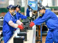 Employees working on a battery production line at a factory in an eastern Chinese province. (STR/AFP via Getty Images)