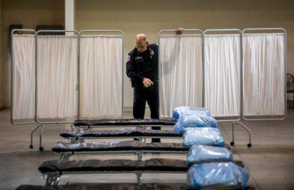 A Health Public Information Officer, looks at beds at a temporary hospital which is been settled up by members of the California National Guard in Indio, California on March 29, 2020. - The new field hospital with 125 bedswill help ease the burden on the local hospital system amid the …