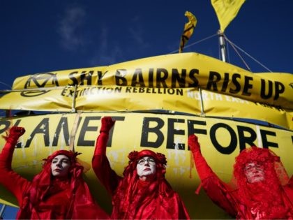 CONSETT, ENGLAND - FEBRUARY 27: Extinction Rebellion's Red Rebel Brigade join demonstrators as they begin their second of a three-day mass action protest at the Bradley Open Cast coal mine on February 27, 2020 in Consett, England. The ‘We are the Dead Canaries’ action is the first of many during …