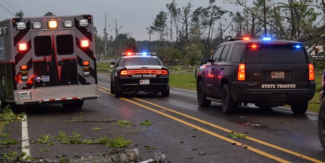 First responders maneuver around downed power lines and trees to make their way to rescue locations. (Photo: Lana Shadwick/Breitbart Texaas)
