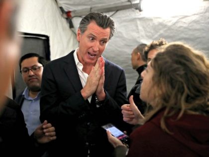OAKLAND, CALIFORNIA - JANUARY 16: California Gov. Gavin Newsom speaks talks with a reporter after a news conference about the state's efforts on the homelessness crisis on January 16, 2020 in Oakland, California. Newsom was joined by Oakland Mayor Libby Schaaf to announce that Oakland will receive 15 unused FEMA …