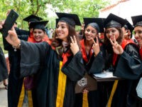 Students take selfie after receiving their Doctor of Philosophy (PhD) degree during the Golden Jubilee Year Convocation at the Guru Nanak Dev University (GNDU) in Amritsar on July 19, 2019. (Photo by NARINDER NANU / AFP) (Photo credit should read NARINDER NANU/AFP via Getty Images)