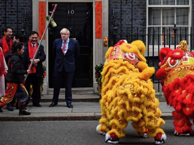 Britain's Prime Minister Boris Johnson reacts as he hosts a Chinese New Year reception at