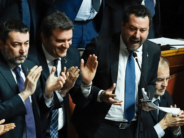 Italian Lega party far-right leader Matteo Salvini (R), supported by Lega member Gian Marc