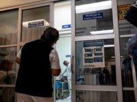 A nurse checks a patient inside an isolated room set for posible Coronavirus cases in Tijuana's General Hospital, in Tijuana, Mexico, on March 2, 2020. - Mexico confirmed its fourth case of the new coronavirus on Saturday, February 29, 2020, after a young woman tested positive for infection. (Photo by …