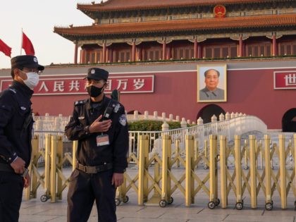 BEIJING, CHINA - MARCH 16: Two chinese police wears a protective mask as they stands in front of the Tiananmen Gate on March 16, 2020 in Beijing, China. Since the new coronavirus covid-19 first emerged in late December 2019, more than 170,000 cases have been recorded in 150 countries and …