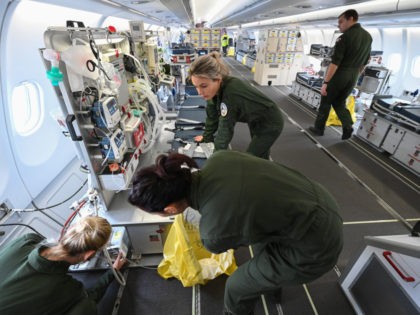 Medical personnel in a medicalized Airbus A330 of the French army check the equipment before taking off on March 31, 2020 from the Istres military base in southeastern France, for Mulhouse in eastern France to evacuate patients infected with the COVID-19 (novel coronavirus) to a hospital facility in Hambourg, Germany. …