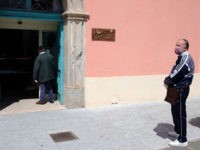 People stand apart as they respect the 'social distancing' requirments to help curb the spread of the novel coronavirus, COVID-19, as they queue in front of a grocery store in Locri, a southern Italian city in the Calabria region, on April 7, 2020. - At the Locri hospital in southern …