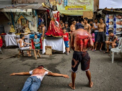 MANILA, PHILIPPINES - APRIL 10: Barefoot flagellants whip their bloodied backs along a street as penance, defying government orders to avoid religious gatherings and stay home to curb the spread of the coronavirus, as they commemorate Good Friday on April 10, 2020 in Manila, Philippines. Good Friday is a Christian …