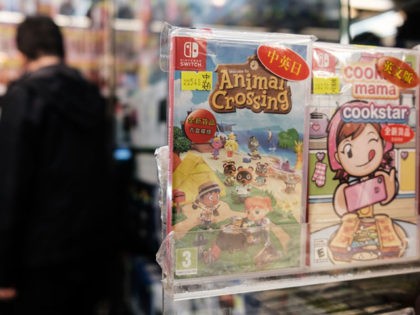 A copy of Nintendo computer game Animal Crossing: New Horizons (C) is displayed in a shopp