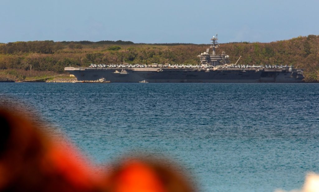 The aircraft carrier USS Theodore Roosevelt is docked at Naval Base Guam in Apra Harbor on April 10, 2020. - At least 416 sailors aboard the aircraft carrier, or 8.6 percent of the ships crew of 4,800, have tested positive for the novel coronavirus, with the numbers increasing daily. according to news media reports. (Photo by Tony AZIOS / AFP) (Photo by TONY AZIOS/AFP via Getty Images)