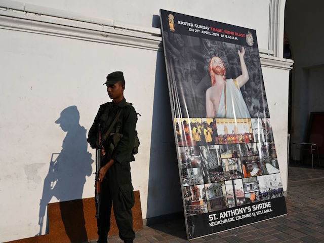 A Sri Lankan army soldier stands guard outside St. Anthony's church on the the first anniversary of the Easter Sunday bombings of 2019, in the capital Colombo on April 12, 2020 as the country remains under an indefinite curfew as part of measures to contain the spread of the COVID-19 …