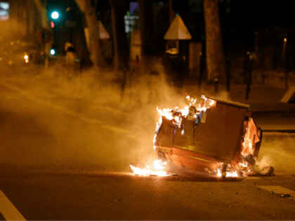 A trash in burns in the street during clashes in Villeneuve-la-Garenne, in the northern suburbs of Paris, early on April 21, 2020. - Tension with the police erupted again on the evening of April 20 in Villeneuve-la-Garenne near Paris, where a motorcycle accident involving the police had provoked the first …