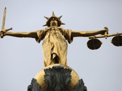 LONDON, ENGLAND - FEBRUARY 16: A statue of the scales of justice stand above the Old Bailey on February 16, 2015 in London, England. (Photo by Dan Kitwood/Getty Images)
