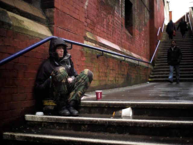 MANCHESTER, UNITED KINGDOM - FEBRUARY 25: A man begs for loose change on the streets of Manchester on February 25, 2015 in Manchester, United Kingdom. As the United Kingdom prepares to vote in the May 7th general election many people are debating some of the many key issues that they …