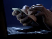 Scammer holds smartphone, cracks two-factor authentication, steals money online, stock footage