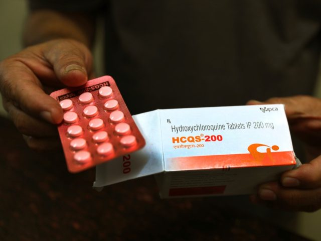 FILE - In this Thursday, April 9, 2020 file photo, a chemist displays hydroxychloroquine tablets in New Delhi, India. Scientists in Brazil have stopped part of a study of the malaria drug touted as a possible coronavirus treatment after heart rhythm problems developed in one-quarter of people given the higher …