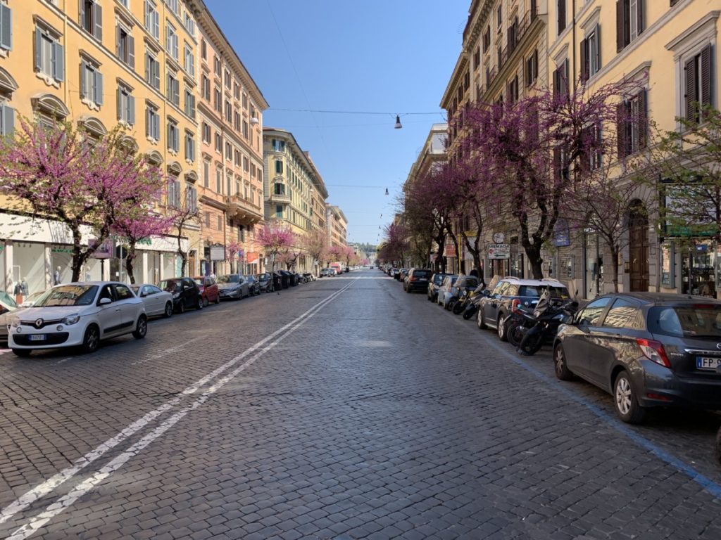 Via Cola di Rienzo, a tony shopping area bedecked with spring buds but bereft of people.