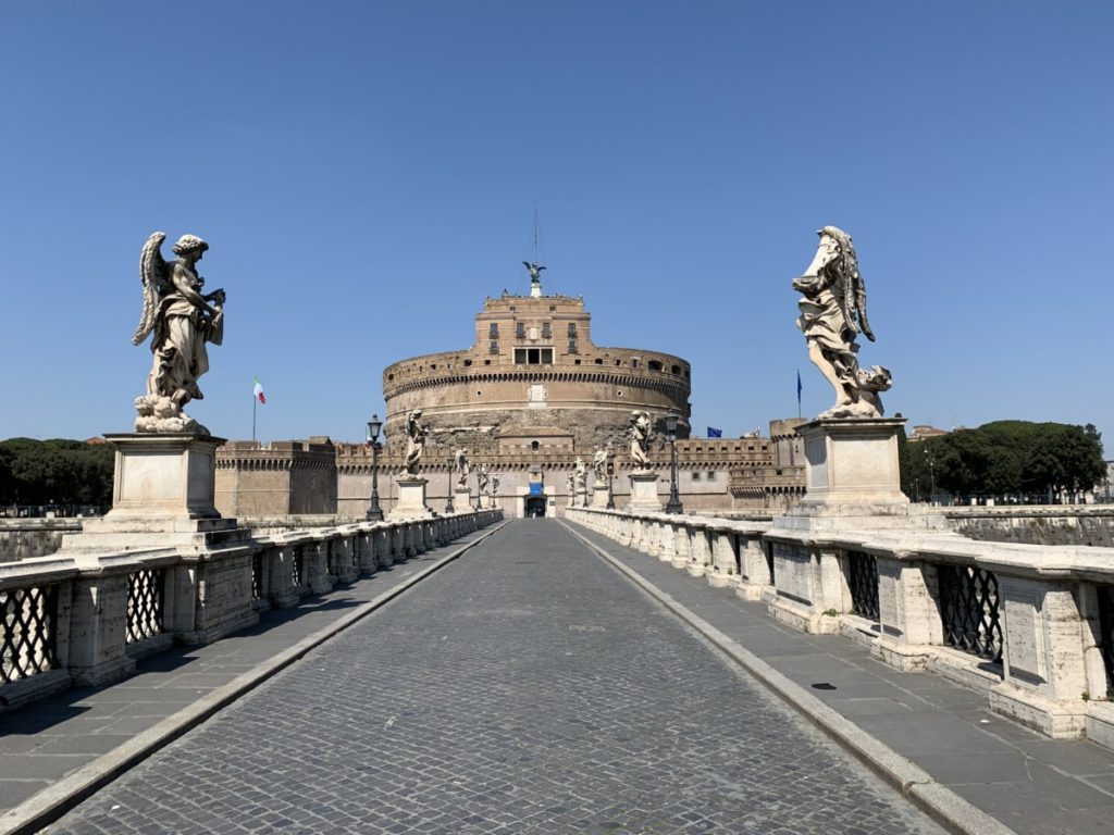 Crossing Rome's normally teeming Angel bridge to Castel Sant'Angelo.